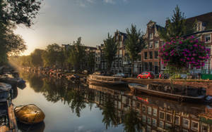 Amsterdam Netherlands Canal Houses In Sunrise Wallpaper