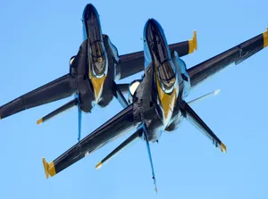 An Aerial Demonstration Of The U.s. Navy Flight Demonstration Squadron, The Blue Angels. Wallpaper