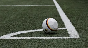 An Aerial View Of A Corner Kick In A Soccer Match Wallpaper