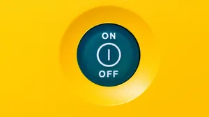 An Eco-friendly Power Switch Set To Green. Wallpaper