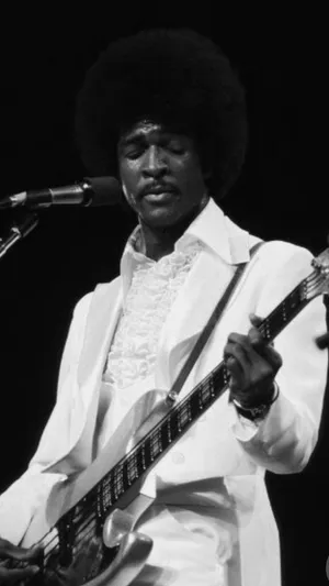 An Iconic Snapshot Of Sly And The Family Stone Along With Larry Graham. Wallpaper