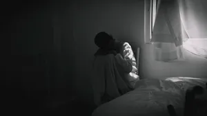 An Individual Contemplating In Solitude Amidst A Serene Backdrop Wallpaper