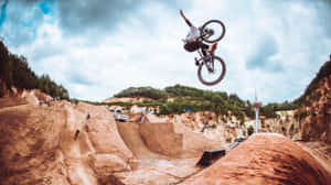 An Intense And Thrilling Bmx Jump Wallpaper