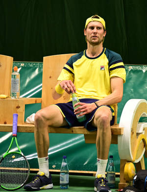 Andreas Seppi Reflectively Sitting On A Bench Wallpaper