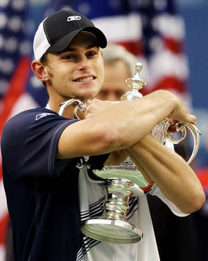 Andy Roddick Holding The 2003 Us Open Tennis Trophy Wallpaper