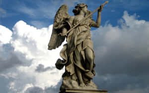 Angel_ Statue_ Against_ Cloudy_ Sky.jpg Wallpaper