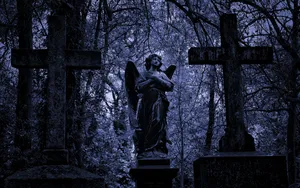 Angel Statue In A Graveyard Wallpaper