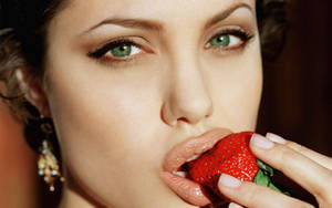 Angelina Jolie Eating Strawberry Close-up Wallpaper