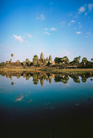 Angkor Wat Reflected In The Blue Water Wallpaper