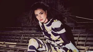 Anne Hathaway In Black And Yellow Jumpsuit Wallpaper