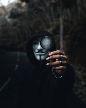 Anonymous Handheld Magnifier Wallpaper