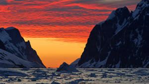 Antarctica Bleeding Red Orange Sky Wallpaper