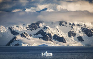 Antarctica Mountain Covered By Clouds Wallpaper