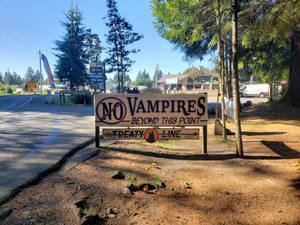 Anti-vampire Banner Featuring The Town Name In Forks, Washington. Wallpaper