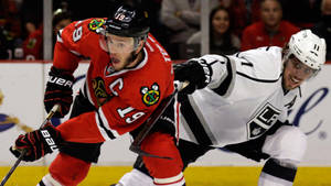 Anze Kopitar In Action During A Game Against The Chicago Blackhawks. Wallpaper