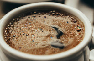 Aromatic Black Coffee In A Classic Cup Wallpaper