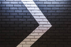 Arrow On Bricks Wallpaper