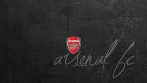 Arsenal Fc Logo On Gray Wall Wallpaper
