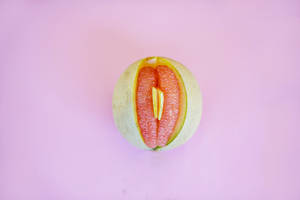 Artistic Representation Of Sexual Symbol Using Pomelo Fruit Wallpaper