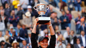 Ashleigh Barty Raising Her Trophy Wallpaper