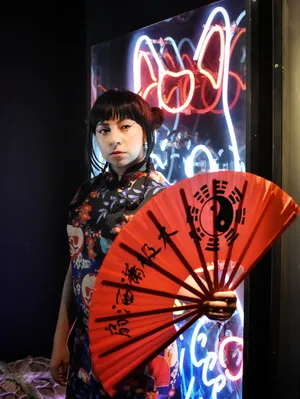 Asian Woman In Floral Chinese Dress Wallpaper