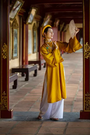 Asian Woman In Traditional Vietnamese Outfit Wallpaper