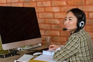 Asian Woman On A Computer Wallpaper