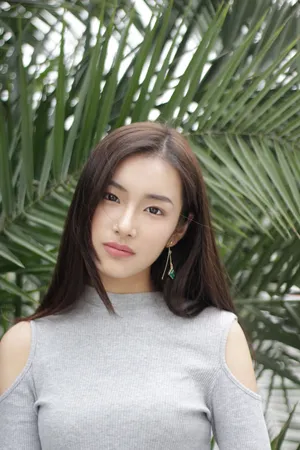 Asian Woman Wearing A Grey Outfit Wallpaper