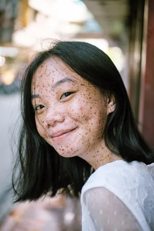 Asian Woman With Unique Facial Features Wallpaper