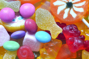 Assortment Of Vibrant Sour Candy Wallpaper