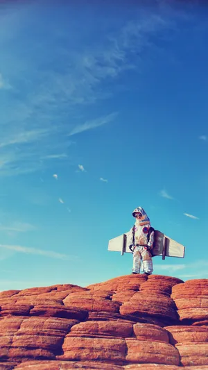 Astronaut Baby On Red Cliff Wallpaper