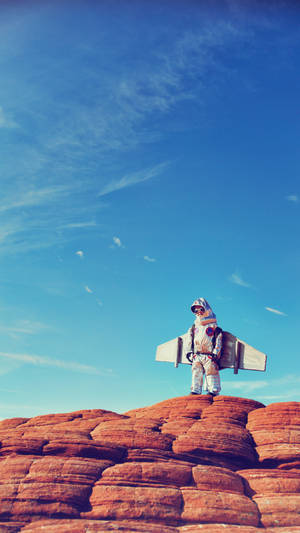 Astronaut Baby On Red Cliff Wallpaper