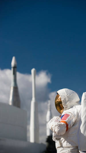 Astronaut By The Rockets Photography Wallpaper