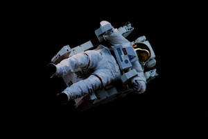 Astronaut In Space Floating While Sitting Wallpaper