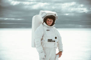 Astronaut In Space Posing In Suit Wallpaper