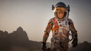 Astronaut Mark Watney Exploring The Martian Landscape. Wallpaper