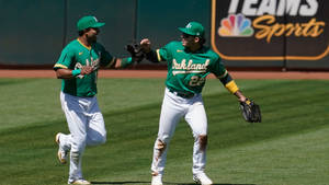 Athletic Teammates At Baseball Game Wallpaper