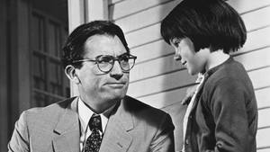 Atticus Finch And Scout Reading In 'to Kill A Mockingbird' Wallpaper