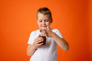 Attitude Boy With Jar Of Chocolate Wallpaper