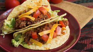 Authentic Flavors - Gourmet Tacos On A Plate Wallpaper