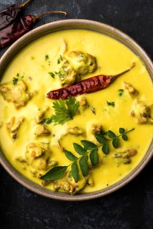 Authentic Yellow Curry With Fenugreek Leaves And Chili Wallpaper