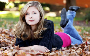 Autumn Bliss - A Beautiful Teenage Girl Among Dried Leaves. Wallpaper