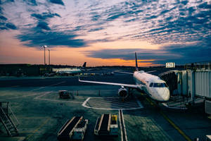 Aviation Passenger Airplane On A Terminal Wallpaper