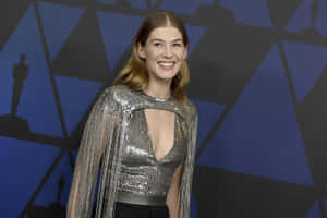 Award-winning Actress Rosamund Pike In A Candid Moment Wallpaper