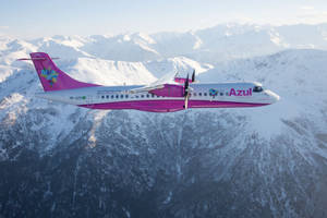 Azul Airlines Gliding Effortlessly Through The Snow-dusted Sky Wallpaper