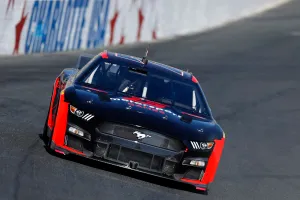 B.j. Mcleod Speeding The Ford Mustang In A Nascar Race Wallpaper