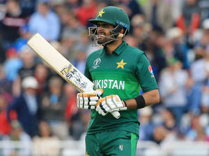 Babar Azam Holding A Cricket Bat Wallpaper