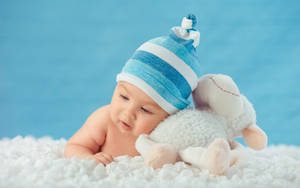 Baby And Stuffed Toy Wallpaper