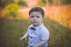 Baby Boy Wearing White Polo Wallpaper