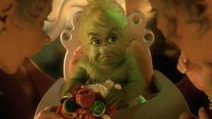 Baby Grinch In High Chair Wallpaper